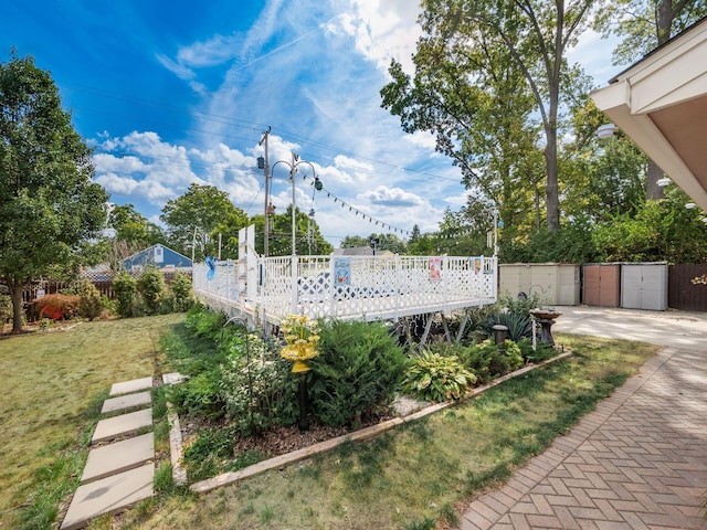 view of swimming pool with a yard