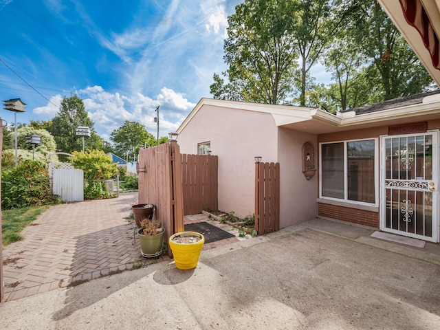 view of side of property with a patio