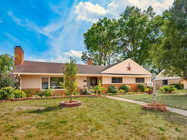 ranch-style home with a front lawn