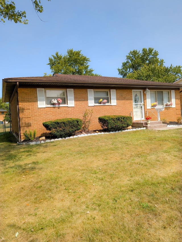 ranch-style home with a front yard