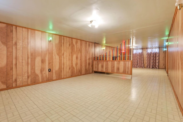 interior space featuring indoor bar and wooden walls