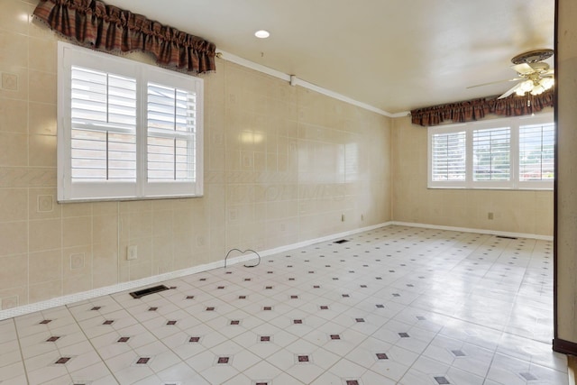 spare room with ceiling fan