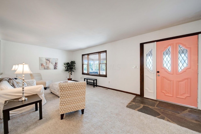 view of carpeted foyer entrance