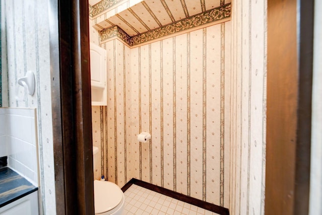 bathroom featuring tile patterned floors and toilet