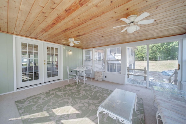 sunroom / solarium with french doors, ceiling fan, a wealth of natural light, and wood ceiling