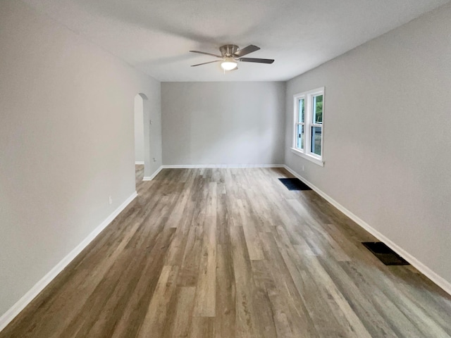 spare room featuring ceiling fan and hardwood / wood-style floors