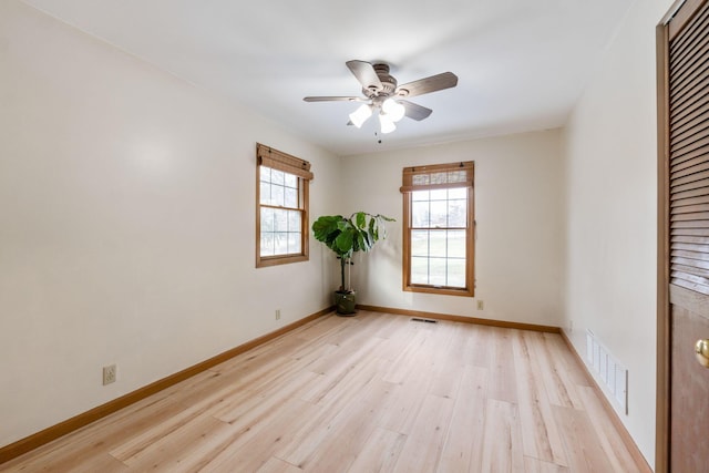 spare room with ceiling fan and light hardwood / wood-style flooring