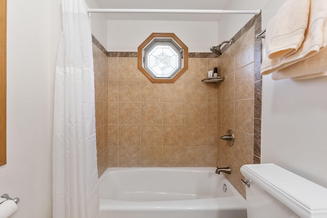 bathroom featuring shower / bathtub combination with curtain and toilet