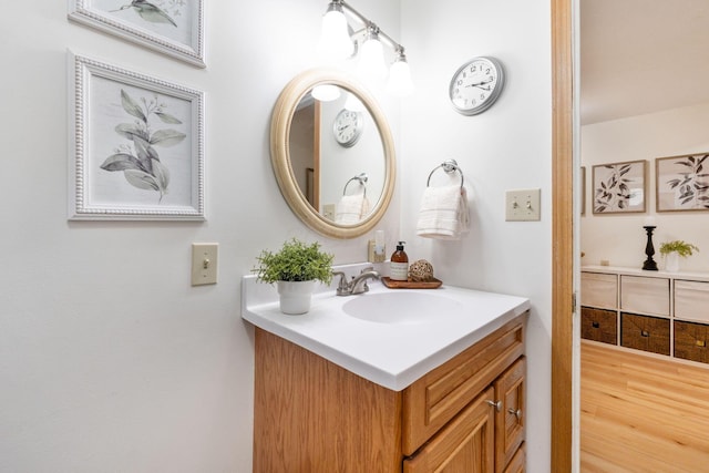 bathroom with vanity and wood-type flooring