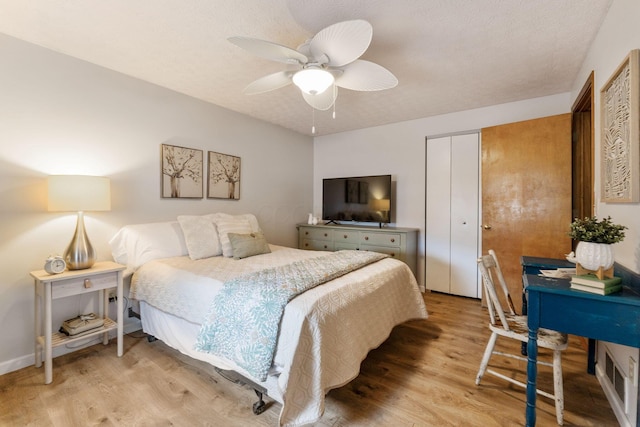 bedroom featuring hardwood / wood-style flooring and ceiling fan