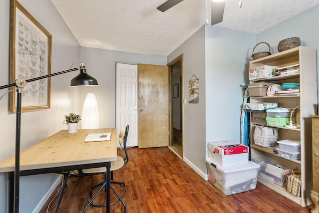 home office with hardwood / wood-style flooring, ceiling fan, and a textured ceiling