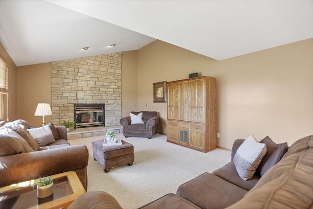 carpeted living room with a fireplace and lofted ceiling