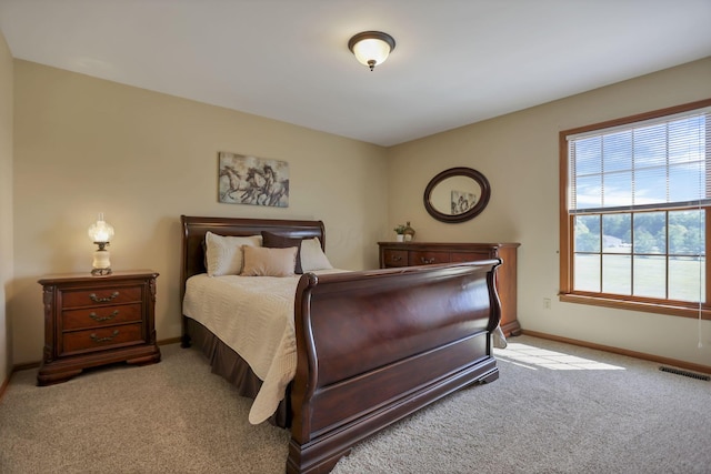 bedroom featuring light colored carpet