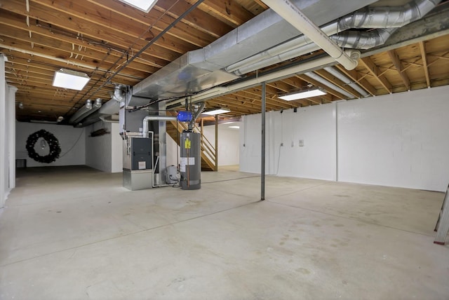 basement with gas water heater and heating unit