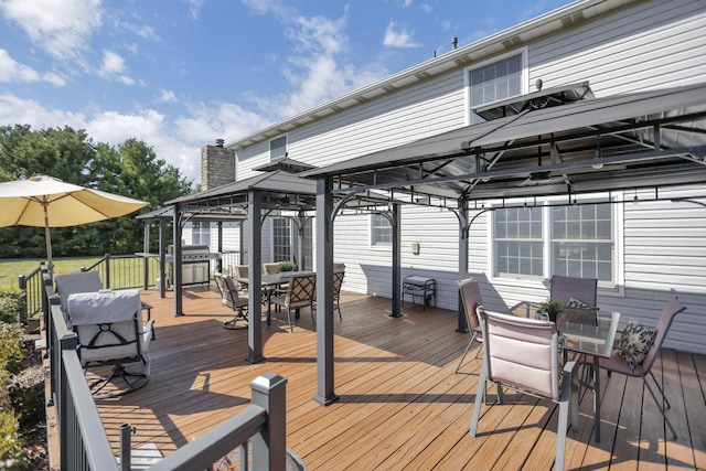 deck with a gazebo and area for grilling