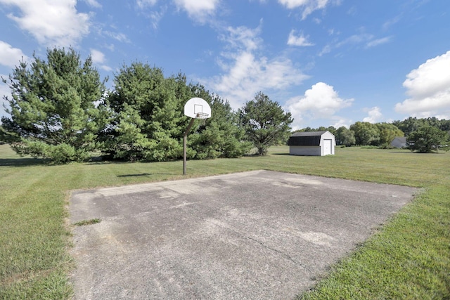 view of patio featuring basketball hoop and a storage unit