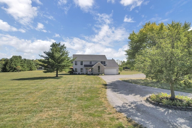 view of front of property with a garage and a front lawn