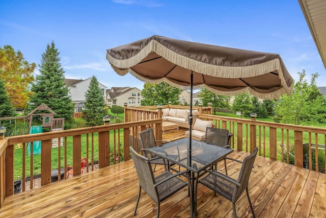 wooden terrace featuring a playground