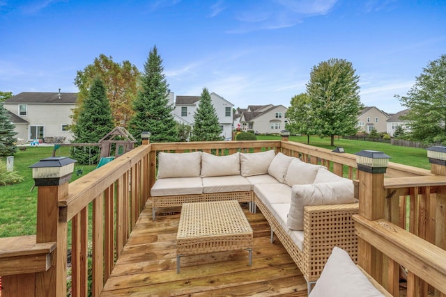 wooden terrace with a yard and outdoor lounge area