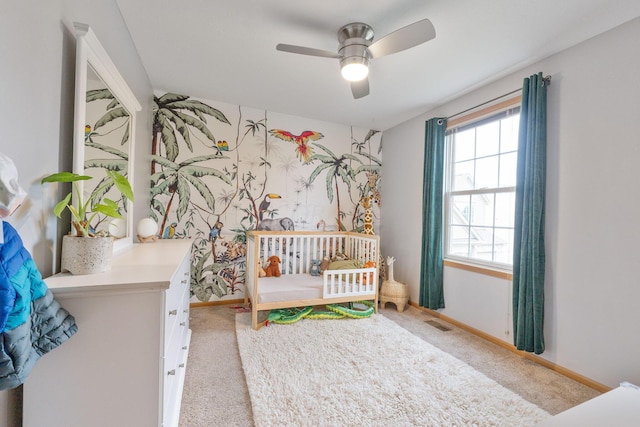 carpeted bedroom featuring ceiling fan