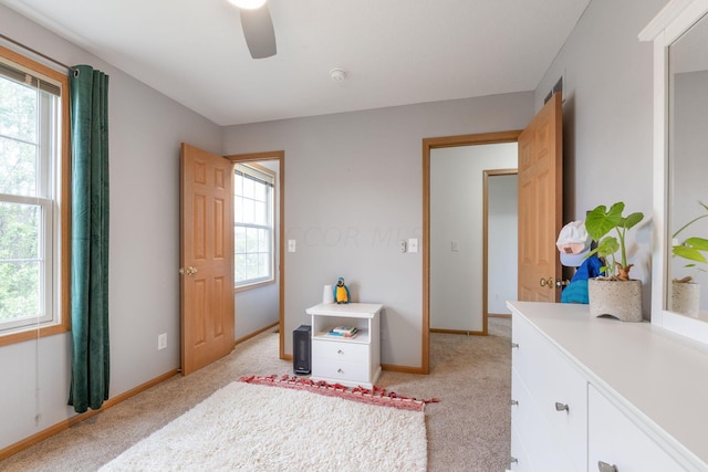 carpeted bedroom featuring ceiling fan