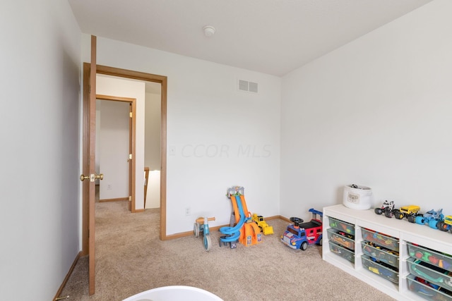 recreation room featuring light carpet