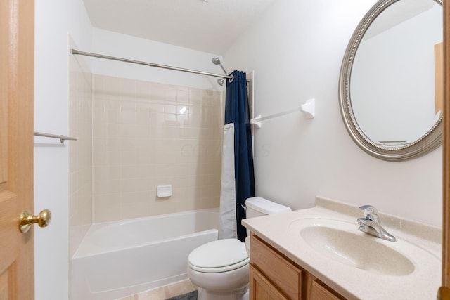 full bathroom featuring shower / tub combo with curtain, vanity, and toilet