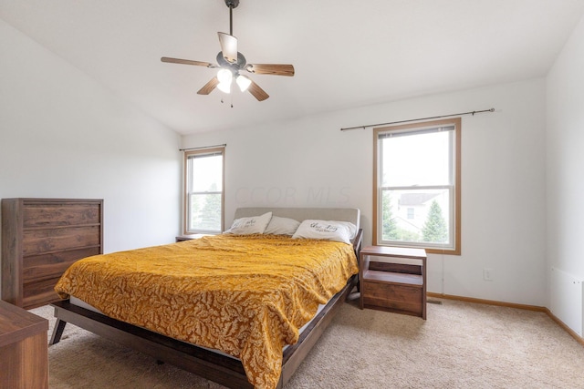 bedroom featuring ceiling fan, lofted ceiling, and carpet