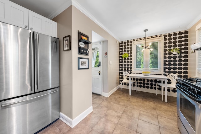 kitchen featuring white cabinetry, crown molding, a chandelier, decorative light fixtures, and appliances with stainless steel finishes