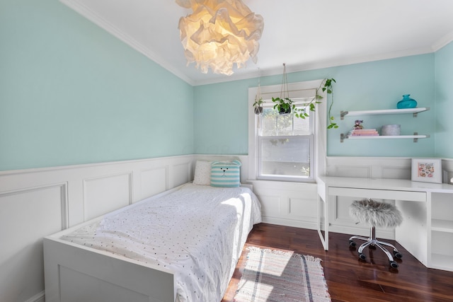 bedroom with dark hardwood / wood-style floors and crown molding