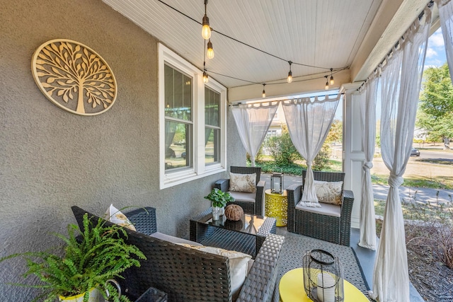 sunroom / solarium with wood ceiling and track lighting