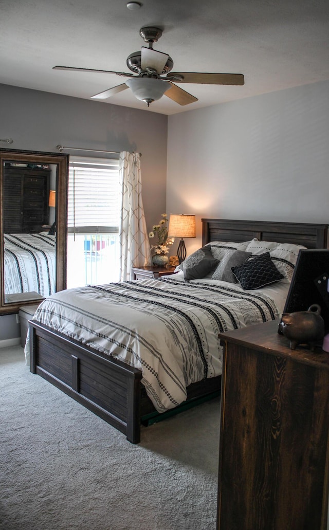 carpeted bedroom featuring ceiling fan