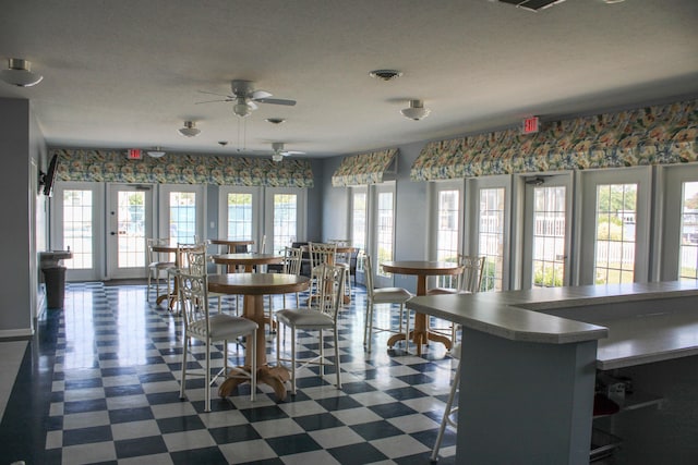 unfurnished dining area with french doors and a healthy amount of sunlight