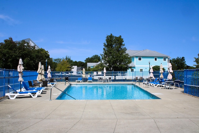 view of swimming pool with a patio area