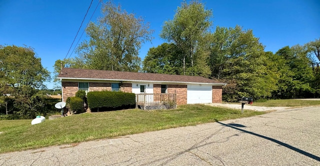 ranch-style home with a front lawn and a garage