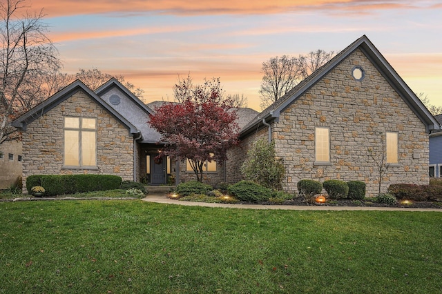 view of front of property with a yard