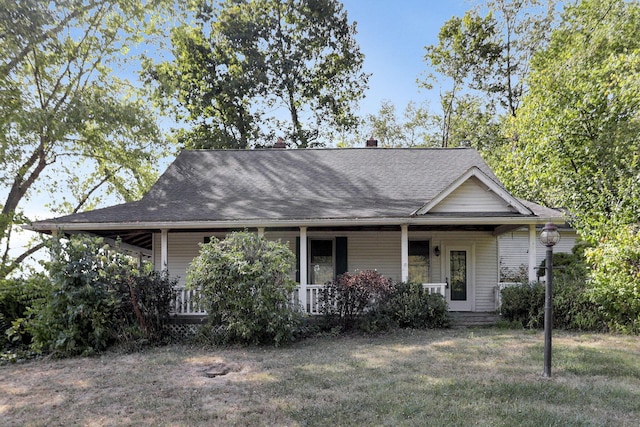 view of front of property with a porch and a front lawn