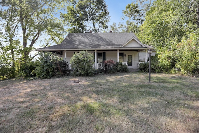 view of front of home with covered porch and a front yard