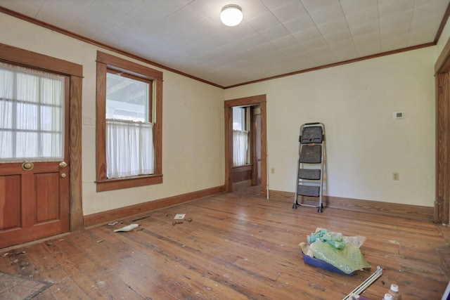 entryway featuring wood-type flooring and ornamental molding