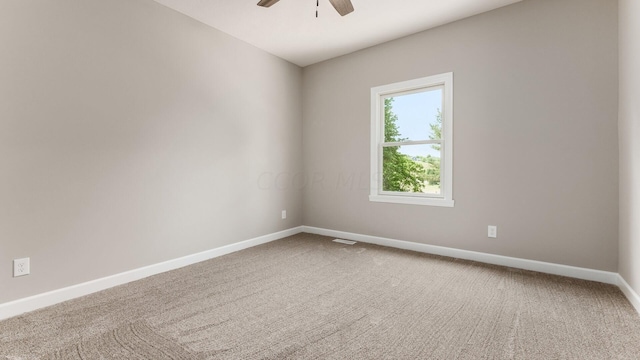 carpeted empty room with ceiling fan