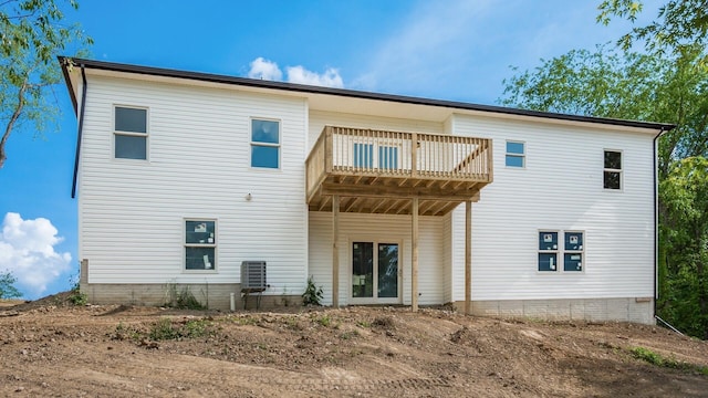 back of house featuring a wooden deck