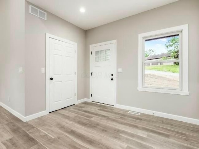 entrance foyer with light wood-type flooring