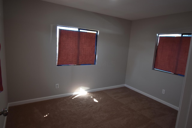 empty room with carpet flooring