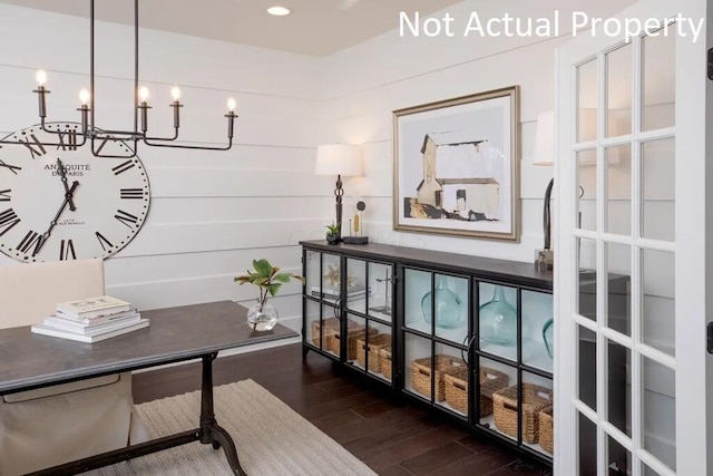 office area with an inviting chandelier and wood finished floors