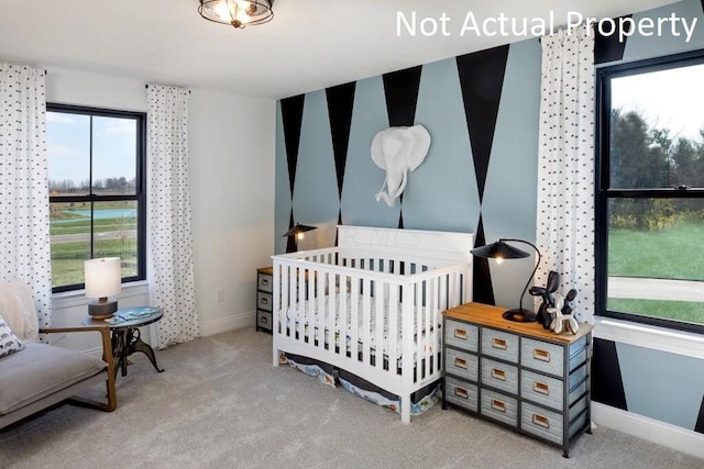 bedroom featuring carpet floors and baseboards