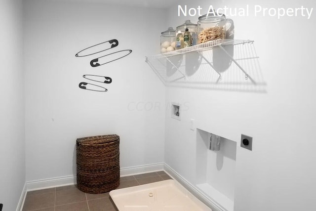laundry room with electric dryer hookup, baseboards, tile patterned flooring, laundry area, and washer hookup