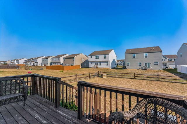 wooden terrace with a yard