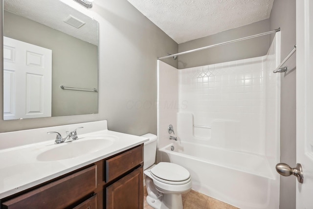 full bathroom with tile patterned flooring, a textured ceiling, toilet, shower / washtub combination, and vanity