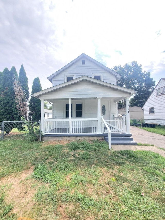 view of front of home with a front lawn and covered porch