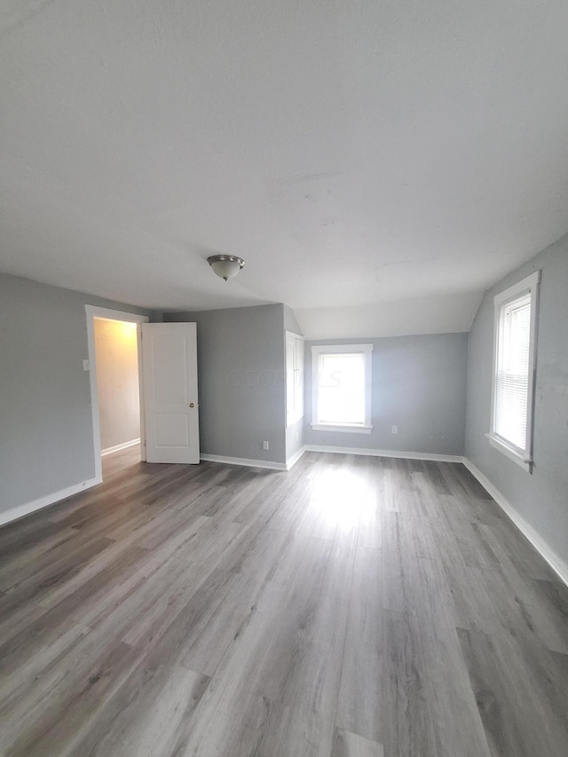 unfurnished room with hardwood / wood-style flooring